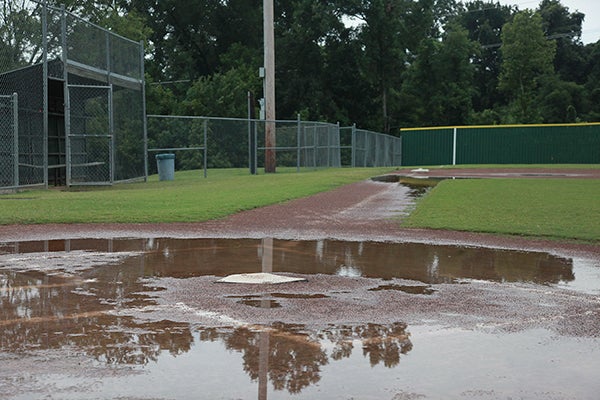 Home plate of Halls Ferry Park's National Field sits in a puddle of water Saturday after rain forced the postponement of the Governor's Cup baseball tournament. No makeup date has been announced. (Ernest Bowker/The Vicksburg Post)