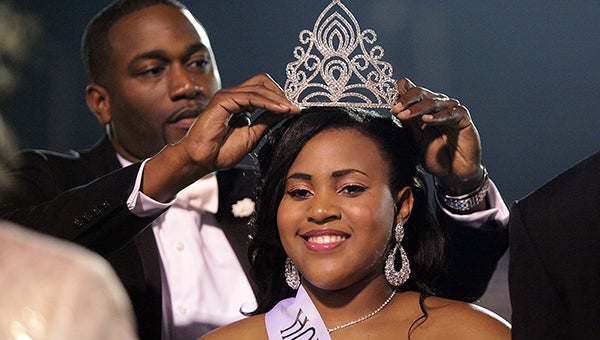 Vicksburg's 2014 homecoming queen Isheana Stamps, 17, is crowned by principal Deowarski McDonald Friday night at Memorial Stadium. (Justin Sellers/The Vicksburg Post)