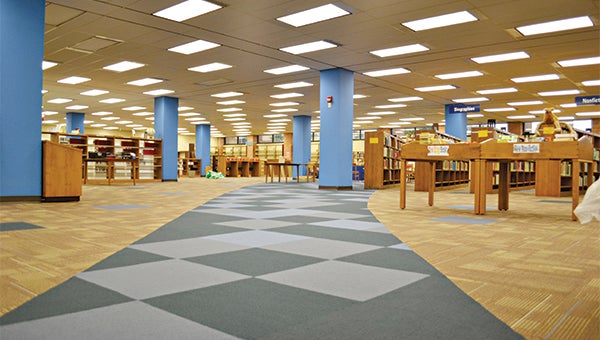 The Warren County-Vicksburg Public Library has installed a new carpet resembling a river from the stairs to the reading area. (Erin Jackson • The Vicksburg Post)