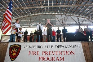 Warren County Sheriff Martin Pace speaks next to Vicksburg Fire Chief Charles Atkins Friday morning during the Vicksburg Fire Department Fire Prevention Program at City Pavilion. Local and state fire and law enforcement officials were at the program to educate and engage children in fire prevention. (Justin Sellers/The Vicksburg Post)