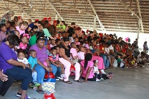 Local preschoolers, teachers and parents listen Friday morning during the Vicksburg Fire Department Fire Prevention Program at City Pavilion. Local and state fire and law enforcement officials were at the program to educate and engage children in fire prevention. (Justin Sellers/The Vicksburg Post)