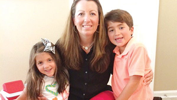Jenny Coleman today, with her daughter Kate, 5, left, and 7-year-old son Josh, right. Coleman now lives in Memphis, where she works as a lawyer for Perkins and Marie Callendars, LLC. 