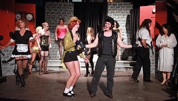 Allison East, portraying Columbia, and Brian Sessums, portraying Eddie, sing Wednesday night along with other cast members during a dress rehearsal of The Rocky Horror Picture Show at the Strand Theatre. (Justin Sellers/The Vicksburg Post)