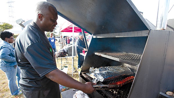 ON THE GRILL: Chris Epps of Tyson Foods grills ribs during the United Way’s Big Pig Out on Saturday at Lady Luck Casino. The event raised about $2,500 for the United Way of West Central Mississippi.