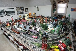 Lionel model trains owned by Charles Riles travel around the track Thursday in his train room at his home. (Justin Sellers/The Vicksburg Post)