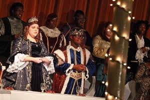 Darbie Woods, left, playing the role of Queen, and Jamison Watson, playing the King, sing with the Vicksburg High School Choir Friday night during their presentation of Singe Feaste at the Southern Cultural Heritage Center. (Justin Sellers/The Vicksburg Post)