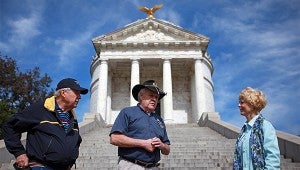 David Harris, center, gives a battlefield tour to David and Vicky Herron of Boerne, Texas outside the Illinois Memorial at the Vicksburg National Military Park. (Justin Sellers/The Vicksburg Post)