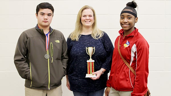 Eighth-grade silver winners are, from left, R.J. Willis, adviser Cathy Wilson, Donesia Harris, Scholastic Academy, Vicksburg.