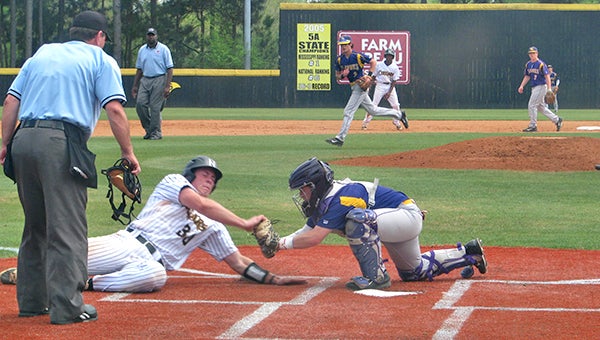 St. Aloysius catcher George Tzotzolas, right, tags Northwest Rankin’s Zach Boone for the final out of the first inning Monday. (Ernest Bowker/The Vicksburg Post)