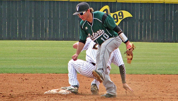 Vicksburg High shortstop Will Martin (10) tries to avoid Northwest Rankin’s Andrew Luley as Luley slides into second on a stolen base attempt in the third inning Monday. (Ernest Bowker/The Vicksburg Post)