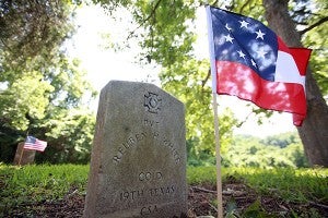 A flag marks the grave of Confederate Pvt. Reuben H. White Friday in the Vicksburg National Cemetery. (Justin Sellers/The Vicksburg Post)