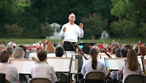 ON CUE: Crafton Beck conducts the Mississippi Symphony Orchestra during their annual Pops concert at Vicksburg National Military Park Saturday night.