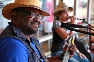 20 YEARS: Ralph Miller of Double Ramm Outlaws performs Saturday during the 20th anniversary celebration at the Outlets at Vicksburg.