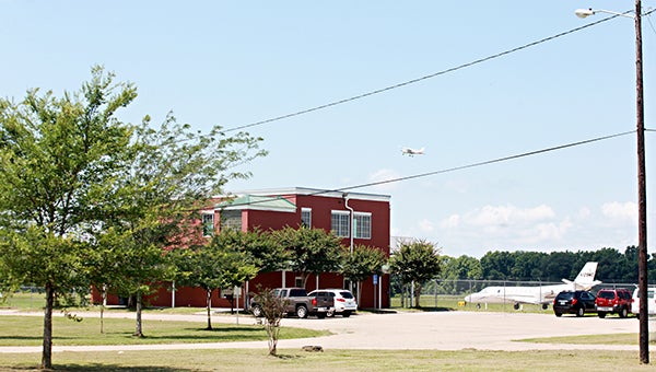 TAKING OFF: A small plane takes off above the terminal at Vicksburg Municipal Airport Thursday.