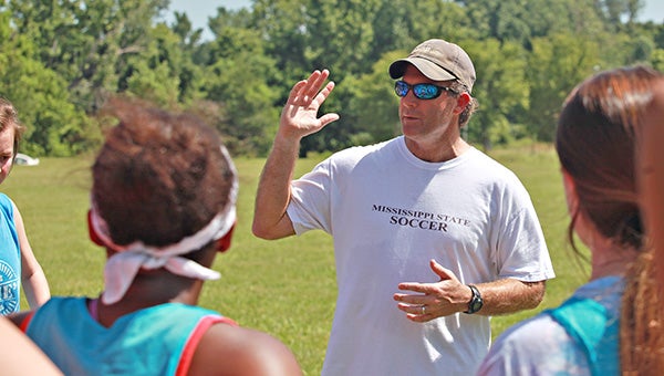 Warren Central girls soccer coach Jay Madison talks to his players during tryouts Wednesday morning. Madison was recently hired as WC’s coach. (Ernest Bowker/The Vicksburg Post)