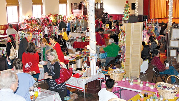 HOLLY DAYS: Shoppers peruse the multitude of items at Holly Days in 2014. This year’s event is Dec. 3.